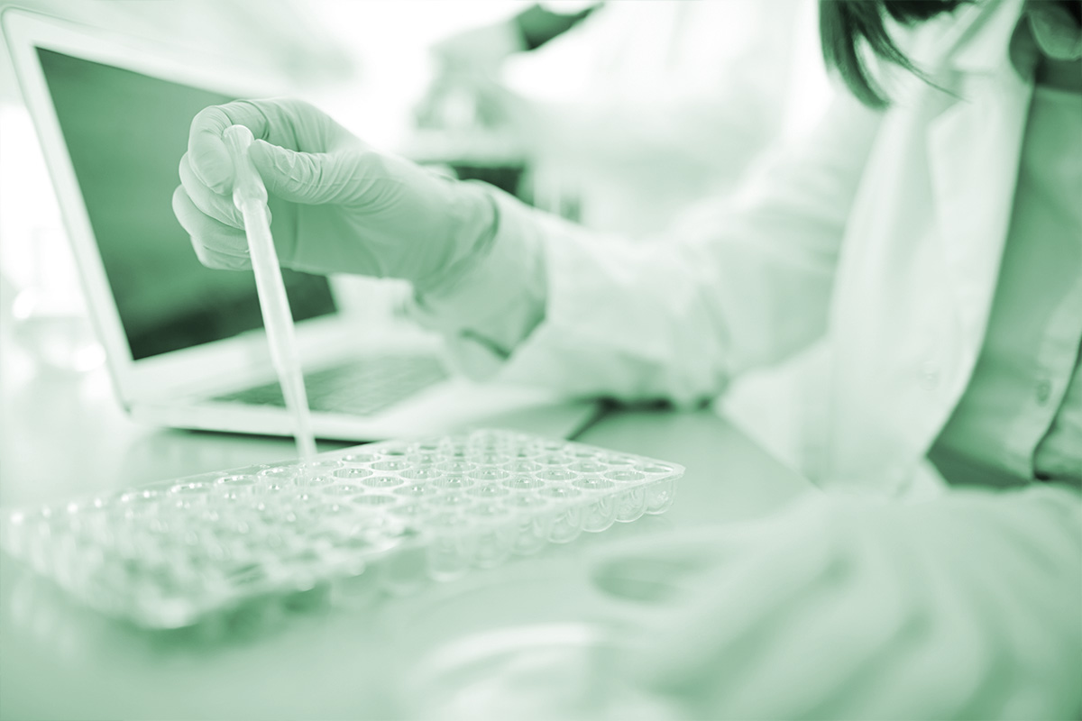 Lab scientist with microscope